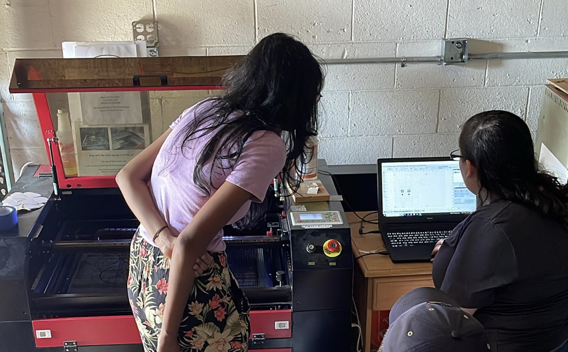 Members using the laser cutter